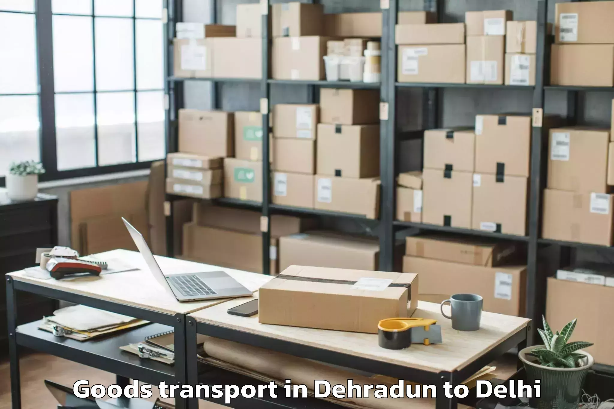 Professional Dehradun to Seema Puri Goods Transport